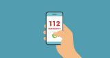 Illustration of a hand holding a phone with the 112 number on the screen 1400x747 1.jpg