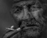 Monochrome man photo anti smoking campaign poster.jpg