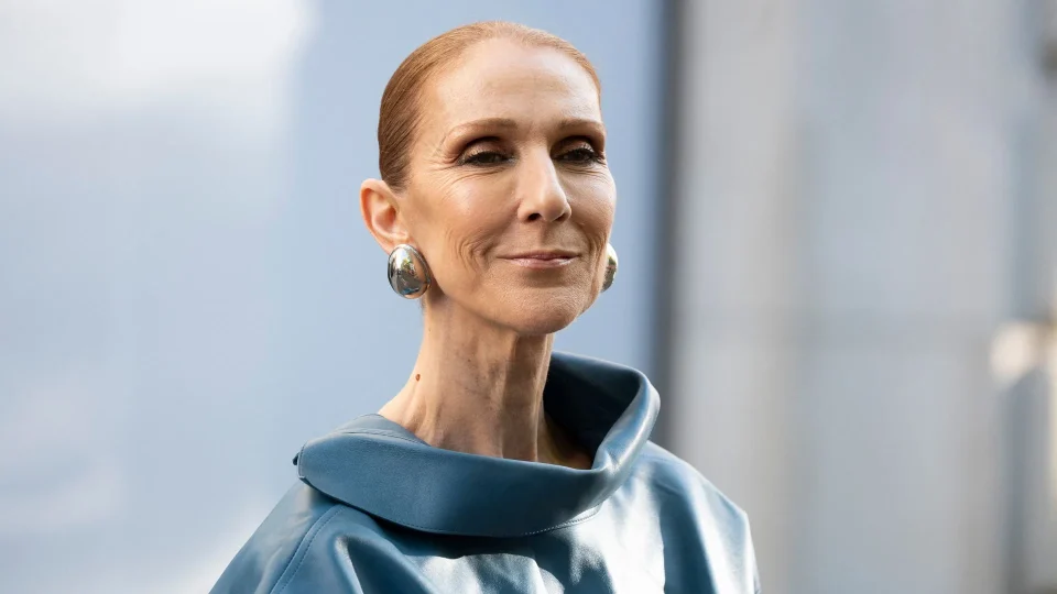 2a2068701a5f celine dion steps out of her hotel and waves to her fans at the royal monceau ho.webp.webp